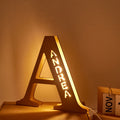 Personalized wooden letter "A" night light with "ANDREA" illuminated, 28CM high, warm LED glow, home decor.