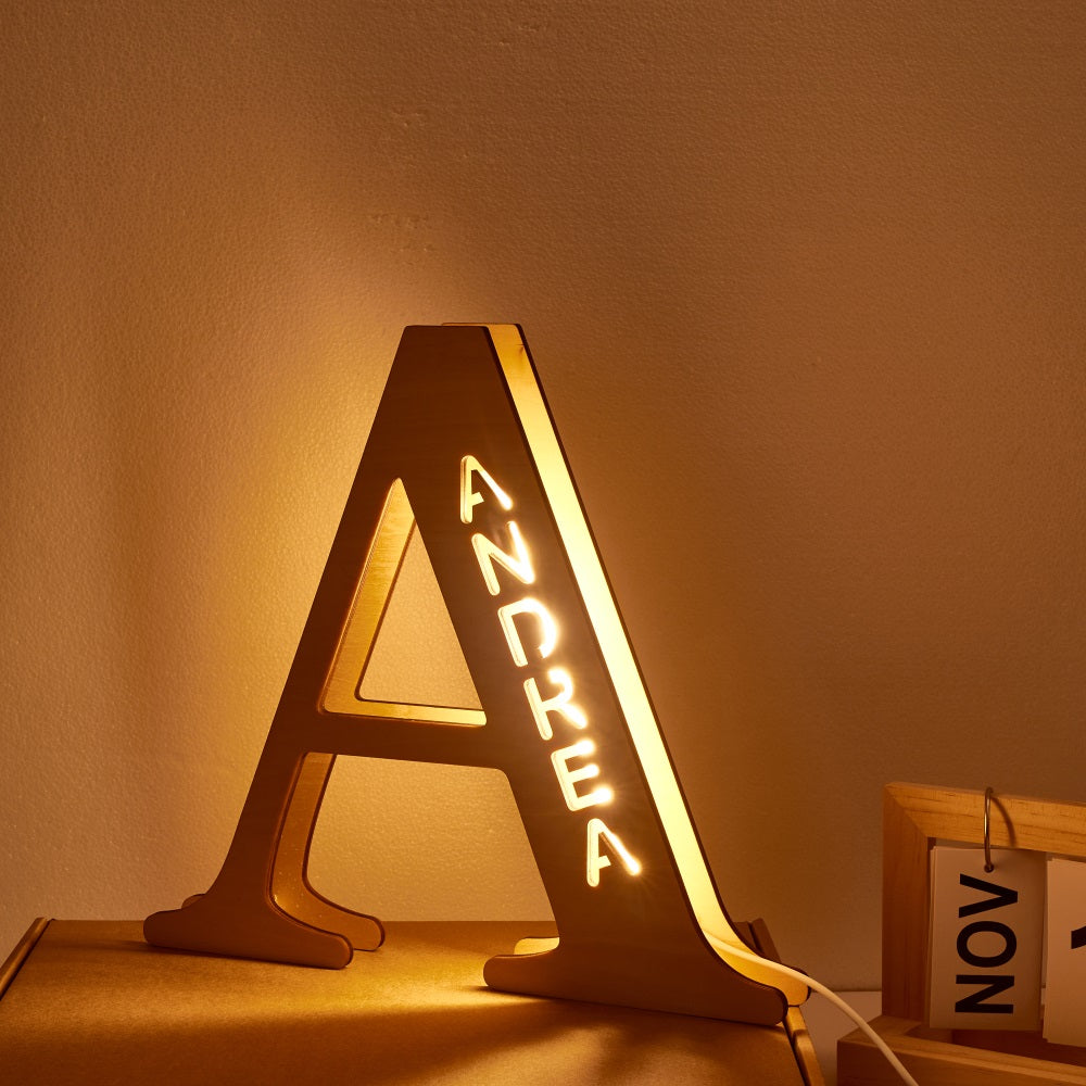 Personalized wooden letter "A" night light with "ANDREA" illuminated, 28CM high, warm LED glow, home decor.