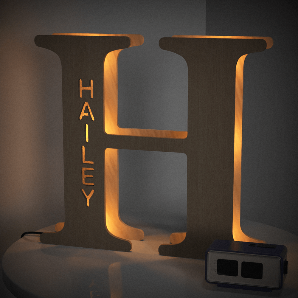 Personalized wooden 'H' night light with 'HAILEY' name illuminated, 28cm tall, warm LED glow for home decor.